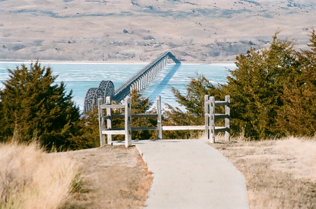 [This is a straight on view of the bridge from an overlook on the hillside above the road.]